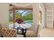Breakfast nook with glass table and chairs overlooking the pool at 13207 49Th E Ln, Parrish, FL 34219