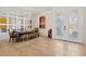 Elegant dining room with a chandelier, mirror wall, and tiled floors at 13207 49Th E Ln, Parrish, FL 34219