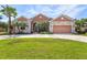 One-story house with stone accents, two-car garage and lush lawn at 13207 49Th E Ln, Parrish, FL 34219