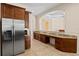 Kitchen with granite countertops and built-in desk area at 13207 49Th E Ln, Parrish, FL 34219