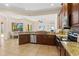Island kitchen with granite countertops and stainless steel appliances at 13207 49Th E Ln, Parrish, FL 34219