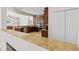 Modern kitchen with dark wood cabinets and granite countertops at 13207 49Th E Ln, Parrish, FL 34219