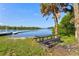 Relaxing picnic table by the river under a palm tree at 13207 49Th E Ln, Parrish, FL 34219