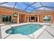 Screened pool and spa with outdoor kitchen at 13207 49Th E Ln, Parrish, FL 34219