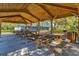 Restrooms and picnic tables under a wooden pavilion at 13207 49Th E Ln, Parrish, FL 34219
