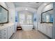 Elegant bathroom with a freestanding tub and double vanities at 14721 Bowfin Ter, Lakewood Ranch, FL 34202