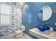 Unique bathroom with blue glass sink and nautical wallpaper at 14721 Bowfin Ter, Lakewood Ranch, FL 34202