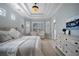 Spacious main bedroom with light wood floors and sitting area at 14721 Bowfin Ter, Lakewood Ranch, FL 34202