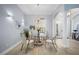 Formal dining room features a round glass table and four chairs at 14721 Bowfin Ter, Lakewood Ranch, FL 34202