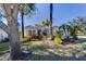 Beautiful curb appeal with lush landscaping and palm trees at 14721 Bowfin Ter, Lakewood Ranch, FL 34202