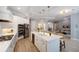 Spacious kitchen with white cabinets, island, and stainless steel appliances at 14721 Bowfin Ter, Lakewood Ranch, FL 34202