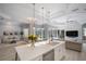 Open kitchen with island, white cabinets, and views to Gathering room at 14721 Bowfin Ter, Lakewood Ranch, FL 34202