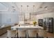 Bright kitchen with white cabinets, island, and quartz countertops at 14721 Bowfin Ter, Lakewood Ranch, FL 34202