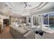Open concept living room and kitchen with large windows and hardwood floors at 14721 Bowfin Ter, Lakewood Ranch, FL 34202