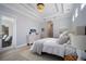 Bright main bedroom with tray ceiling and access to the bathroom at 14721 Bowfin Ter, Lakewood Ranch, FL 34202