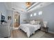 Spacious main bedroom with tray ceiling and access to the bathroom at 14721 Bowfin Ter, Lakewood Ranch, FL 34202
