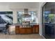 Stainless steel appliances and wood cabinetry highlight this outdoor kitchen at 14721 Bowfin Ter, Lakewood Ranch, FL 34202