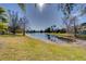 Peaceful pond view with lush landscaping and homes at 14721 Bowfin Ter, Lakewood Ranch, FL 34202