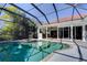 Relaxing pool and spa with covered patio and outdoor kitchen at 14721 Bowfin Ter, Lakewood Ranch, FL 34202