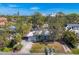 House with driveway, carport, and large yard in a residential neighborhood at 1509 Flower Dr, Sarasota, FL 34239