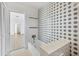Clean bathroom with a bathtub and access to another room at 1509 Flower Dr, Sarasota, FL 34239