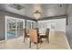 Dining area with glass table and view of the pool and screened lanai at 1509 Flower Dr, Sarasota, FL 34239