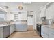 Updated kitchen with stainless steel appliances and light blue cabinetry at 1509 Flower Dr, Sarasota, FL 34239