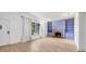 Bright living area featuring hardwood floors and a fireplace with lavender built-ins at 1509 Flower Dr, Sarasota, FL 34239