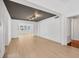 Open living area with hardwood floors and a view into another room at 1509 Flower Dr, Sarasota, FL 34239