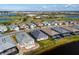 An aerial view showcasing the neighborhood featuring sidewalks, well-maintained lawns and screened in patios at 15610 San Lazzaro Ave, Bradenton, FL 34211