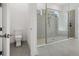 Clean bathroom featuring a glass shower with dual heads and a modern toilet at 15610 San Lazzaro Ave, Bradenton, FL 34211