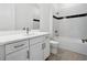 Modern bathroom with a white vanity, a shower/tub combo, and sleek fixtures at 15610 San Lazzaro Ave, Bradenton, FL 34211