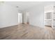Bright bedroom featuring sleek, modern tile flooring and an open doorway at 15610 San Lazzaro Ave, Bradenton, FL 34211