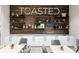 Modern cafe area featuring decorative shelving, a marble countertop, and cozy seating at 15610 San Lazzaro Ave, Bradenton, FL 34211