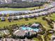 An aerial view of the community showcasing a pool, tropical landscaping, and golf course at 15610 San Lazzaro Ave, Bradenton, FL 34211