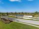Entrance to Esplanade community with lush landscaping, elegant signage, and serene water views at 15610 San Lazzaro Ave, Bradenton, FL 34211