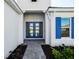 A close-up of the front door and entryway at 15610 San Lazzaro Ave, Bradenton, FL 34211
