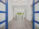 Inviting entryway with elegant tile flooring and a captivating view of the backyard at 15610 San Lazzaro Ave, Bradenton, FL 34211