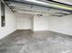 Spacious two car garage featuring high ceilings and concrete flooring at 15610 San Lazzaro Ave, Bradenton, FL 34211
