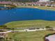 Scenic golf course with a lake and manicured greens, offering a picturesque view and recreational opportunity at 15610 San Lazzaro Ave, Bradenton, FL 34211