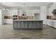 Modern eat-in kitchen with white countertops, stainless steel appliances, and ample storage at 15610 San Lazzaro Ave, Bradenton, FL 34211