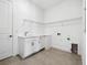 Bright laundry room featuring a utility sink and modern cabinets at 15610 San Lazzaro Ave, Bradenton, FL 34211