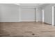Spacious living room boasts wood-look tile flooring and bright, natural light at 15610 San Lazzaro Ave, Bradenton, FL 34211