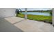 Covered patio featuring serene lake and golf course views for outdoor relaxation and entertaining at 15610 San Lazzaro Ave, Bradenton, FL 34211