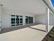 Covered patio with sliding glass doors, offering an seamless indoor/outdoor living experience and natural light at 15610 San Lazzaro Ave, Bradenton, FL 34211