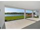 A covered patio showcasing serene views of the lake and golf course for relaxing and entertaining at 15610 San Lazzaro Ave, Bradenton, FL 34211