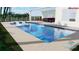 Backyard pool with a sun shelf, tropical landscaping, and space for outdoor seating at 15610 San Lazzaro Ave, Bradenton, FL 34211