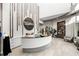 Bright spa reception area with a modern check-in desk and decorative wood accent wall at 15610 San Lazzaro Ave, Bradenton, FL 34211