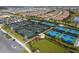 Aerial view of the tennis courts within the community, showcasing well-maintained facilities and landscaping at 15610 San Lazzaro Ave, Bradenton, FL 34211