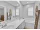 Bright bathroom with double sinks and a bathtub at 1605 Napoli W Dr, Sarasota, FL 34232